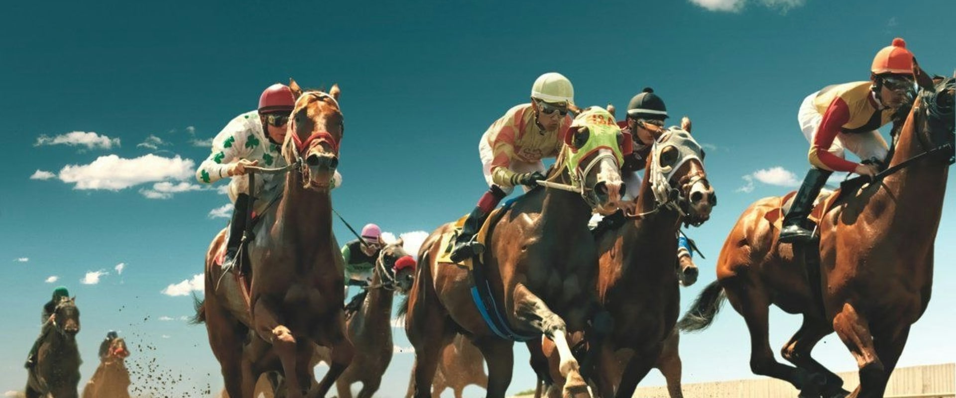 Turf vs. All-Weather Tracks: A Comparison for Horse Racing Enthusiasts
